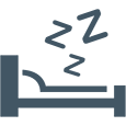 Sleeping person in bed icon