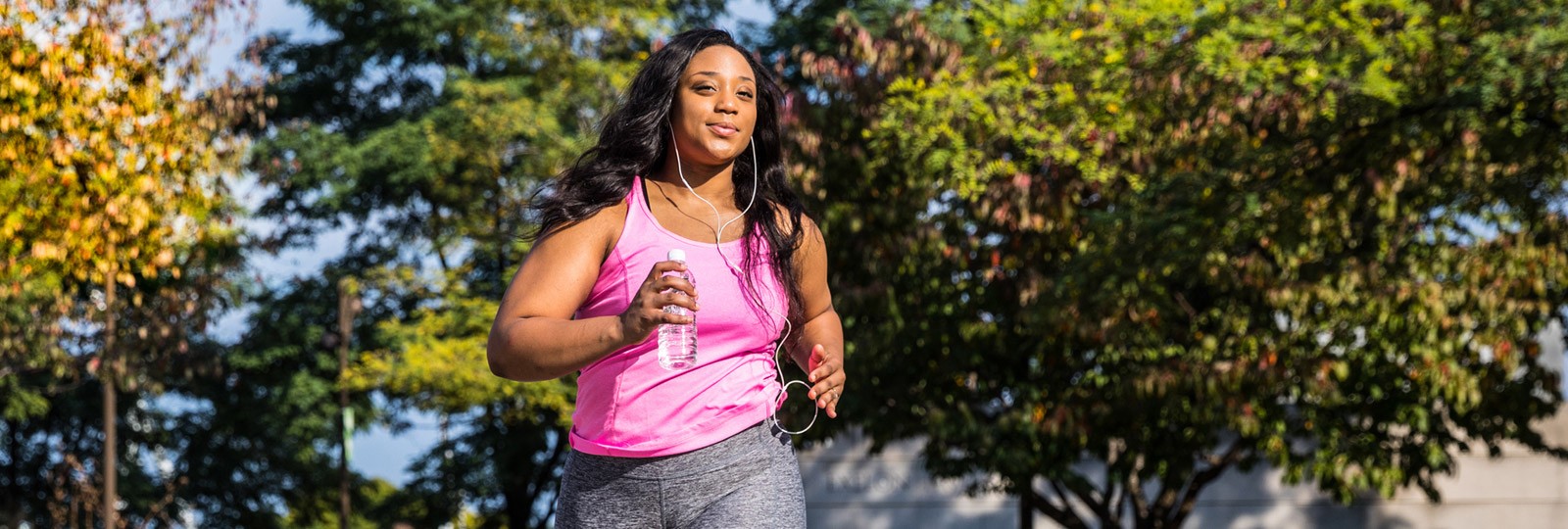 Healthy woman running outside