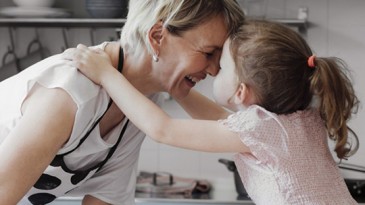 Grandma and granddaughter baking in kitchen