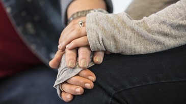 Hands holding for support