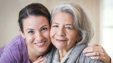Mother and daughter hugging
