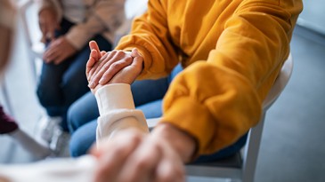 Therapy attendees supporting each other