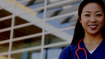 Female doctor in front of hospital