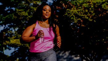 Healthy woman running outside
