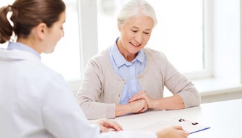 Patient being helped by a caregiver