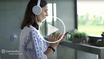 Woman listening to music with headphones