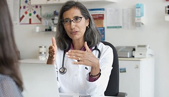 Ob/gyn talking with patient