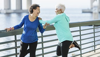 Senior ladies exercising together outdoors
