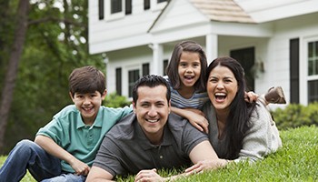 Family in front of their house