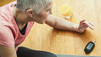 Senior woman checking glucose