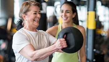Adult woman exercising in gym