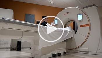 Tech setting up CT scanner