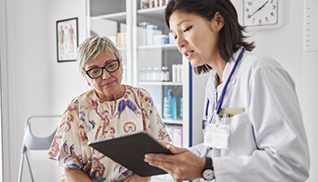 Breast surgery patient consulting with doctor