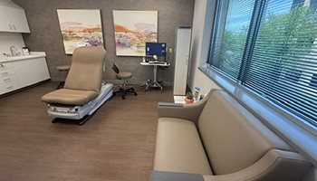 Spacious, private exam room with modern furnishings