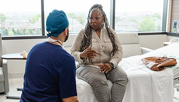 Patient consulting with surgeon